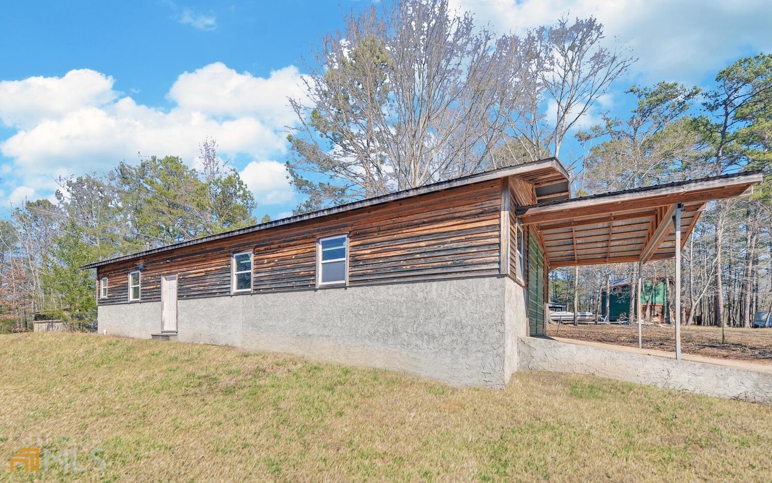 411 Simmons Road Toccoa, GA 30577 - Photo 1 of 1 a view of a house with a snow on the road