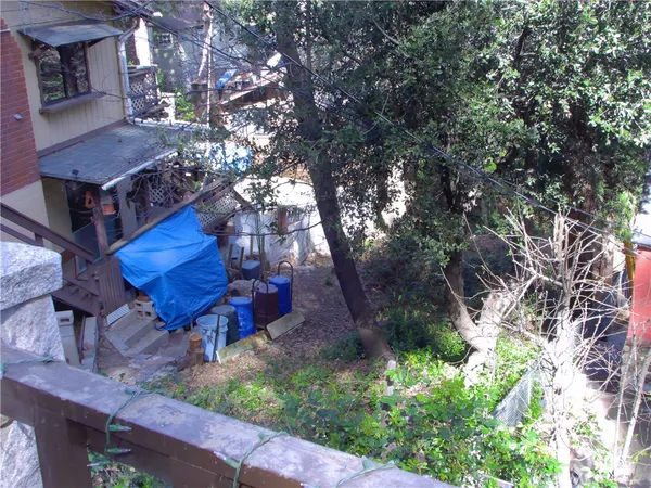 a house view with a backyard space