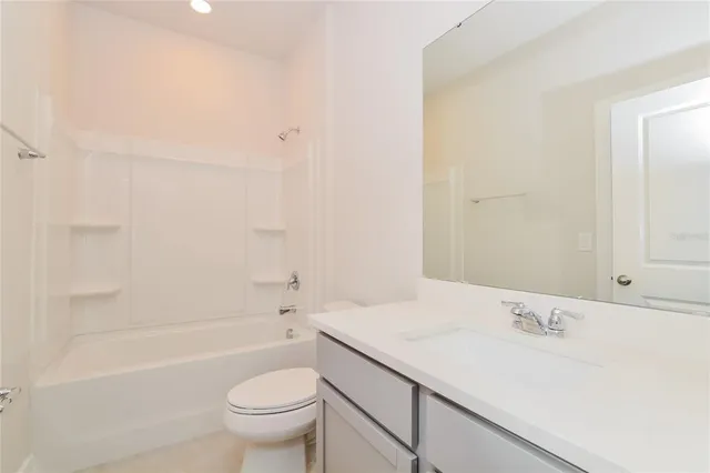 a bathroom with a sink a toilet and a bathtub