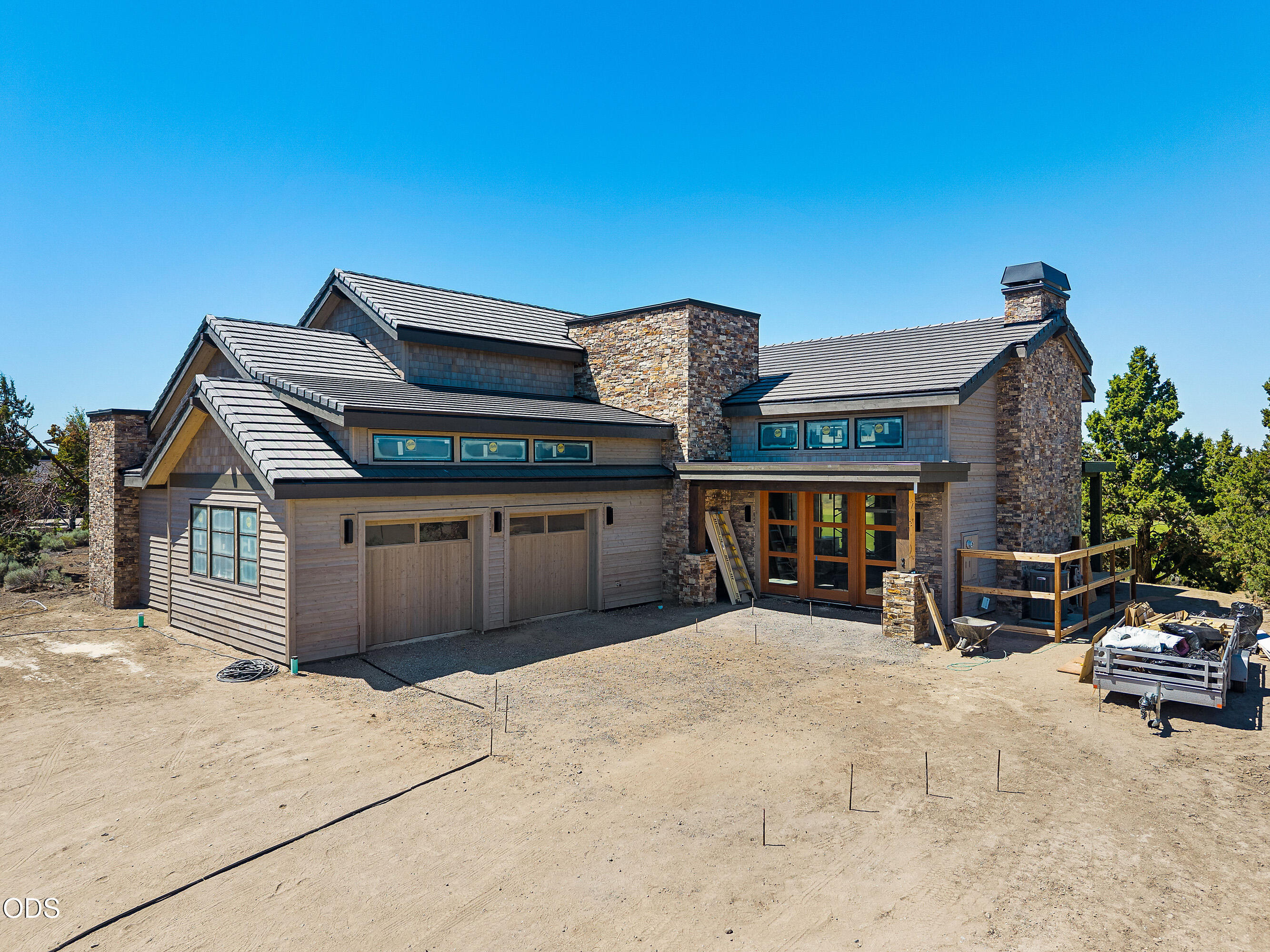 22936 Ghost Tree Lane Bend, OR 97701 - Photo 2 of 45 a view of a house with wooden roof and sitting space