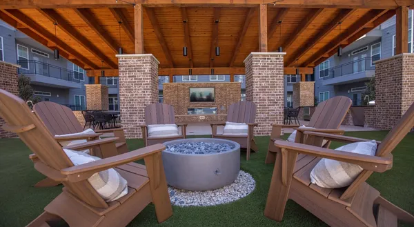 a view of a backyard with table and chairs
