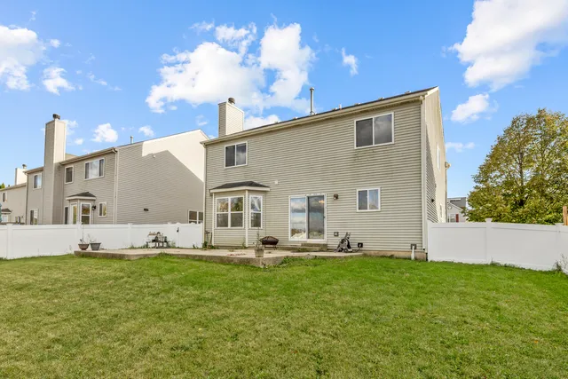 a big yard with table and chairs