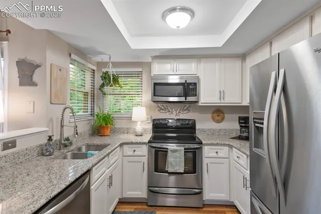 a kitchen with a sink stove and refrigerator