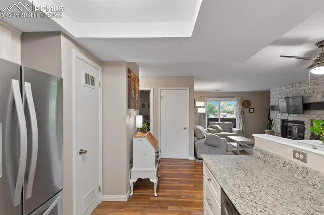a view of living room with furniture and wooden floor