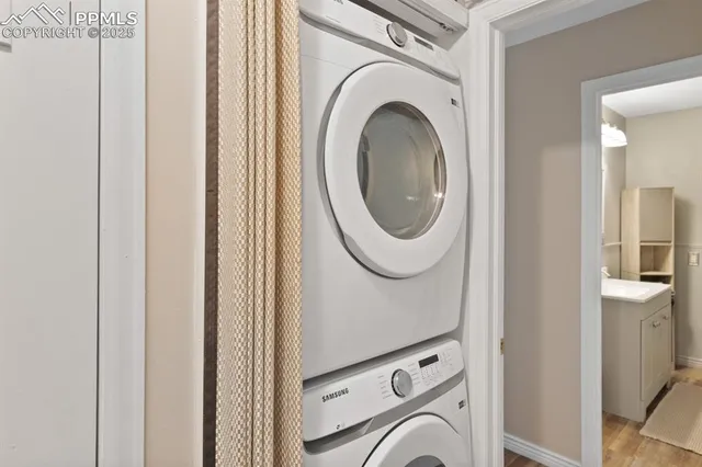 a view of a hallway with washer and dryer