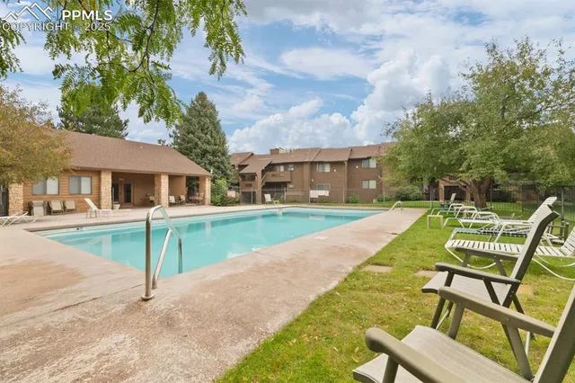 a view of house with a yard