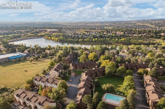 an aerial view of ocean with residential house with outdoor space