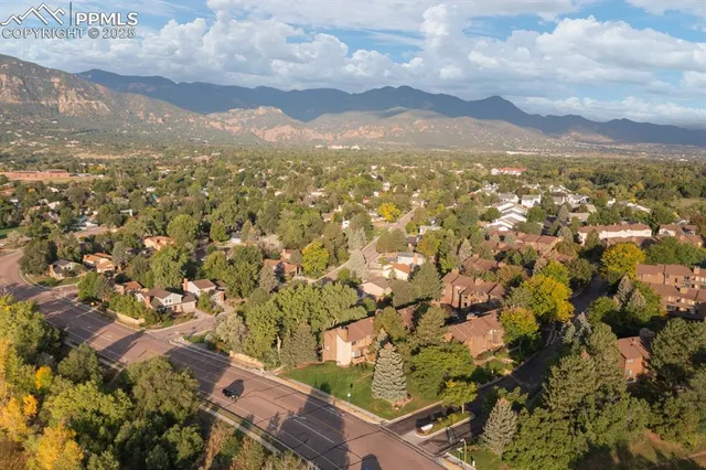an aerial view of residential houses with outdoor space