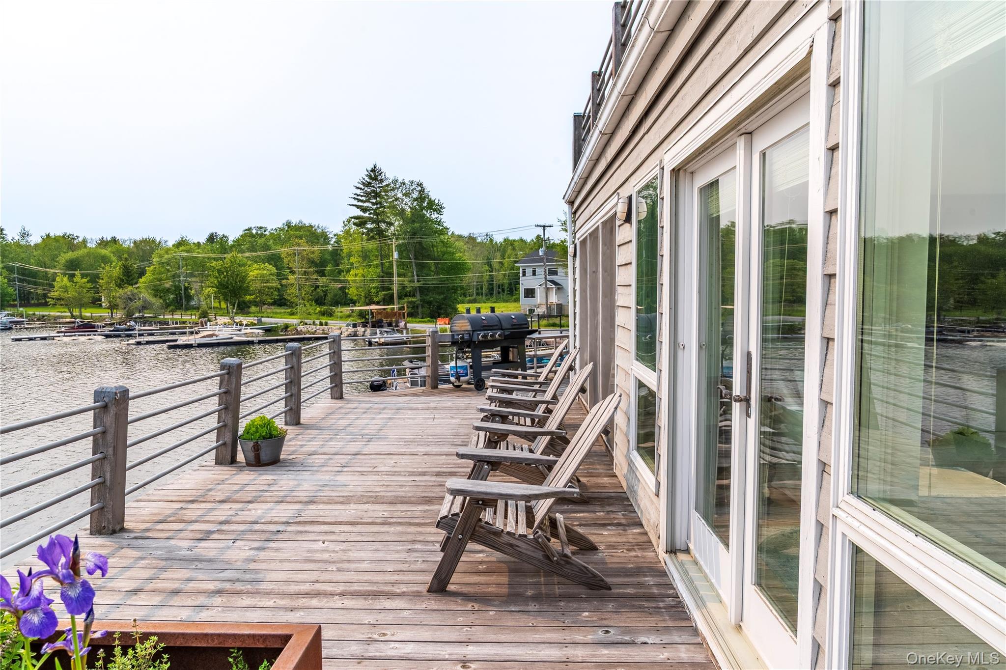 13 West Shore Road Kauneonga Lake, NY 12749 - Photo 11 of 16 a view of balcony with seating space and trees in the background