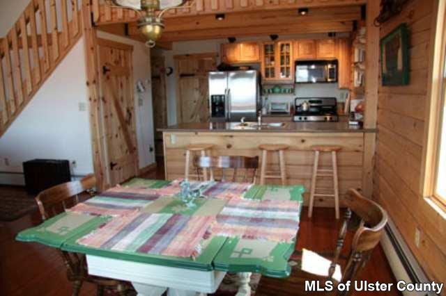 1965 Vega Mountain Road Roxbury, NY 12421 - Photo 1 of 4 a dining room with furniture