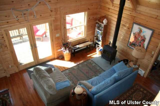 1965 Vega Mountain Road Roxbury, NY 12421 - Photo 2 of 4 a living room with furniture and a flat screen tv