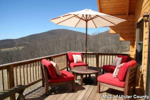 1965 Vega Mountain Road Roxbury, NY 12421 - Photo 3 of 4 an outdoor sitting area with furniture and wooden floor