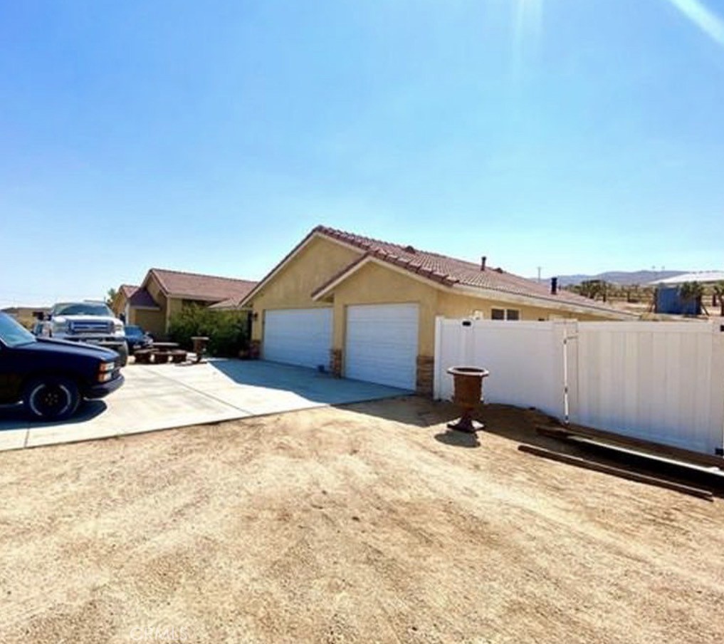 25753 Outpost Road Apple Valley, CA 92308 - Photo 2 of 2 a view of a backyard of a house
