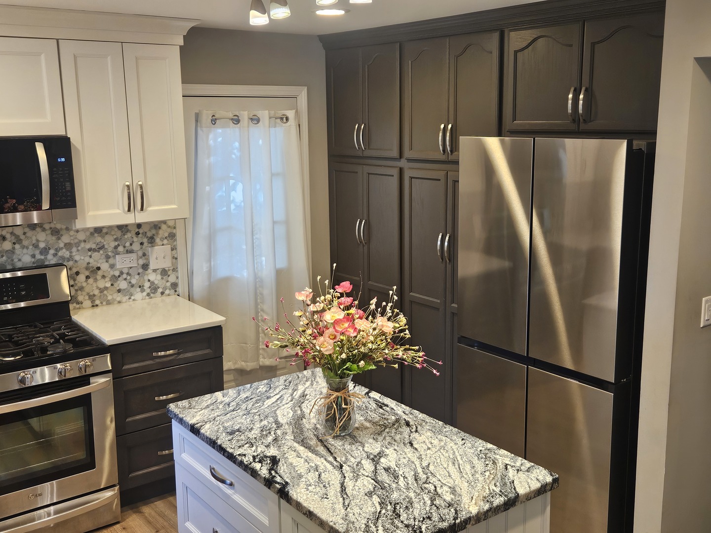 1681 Boulder Ridge Drive Bolingbrook, IL 60490 - Photo 7 of 17 a kitchen with stainless steel appliances granite countertop a refrigerator and a stove