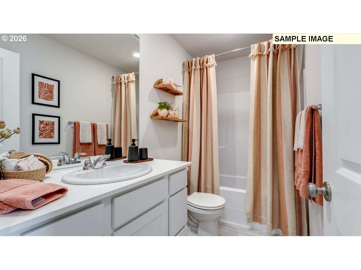 126 Coho Loop Woodland, WA 98674 - Photo 17 of 27 a bathroom with a sink toilet and shower