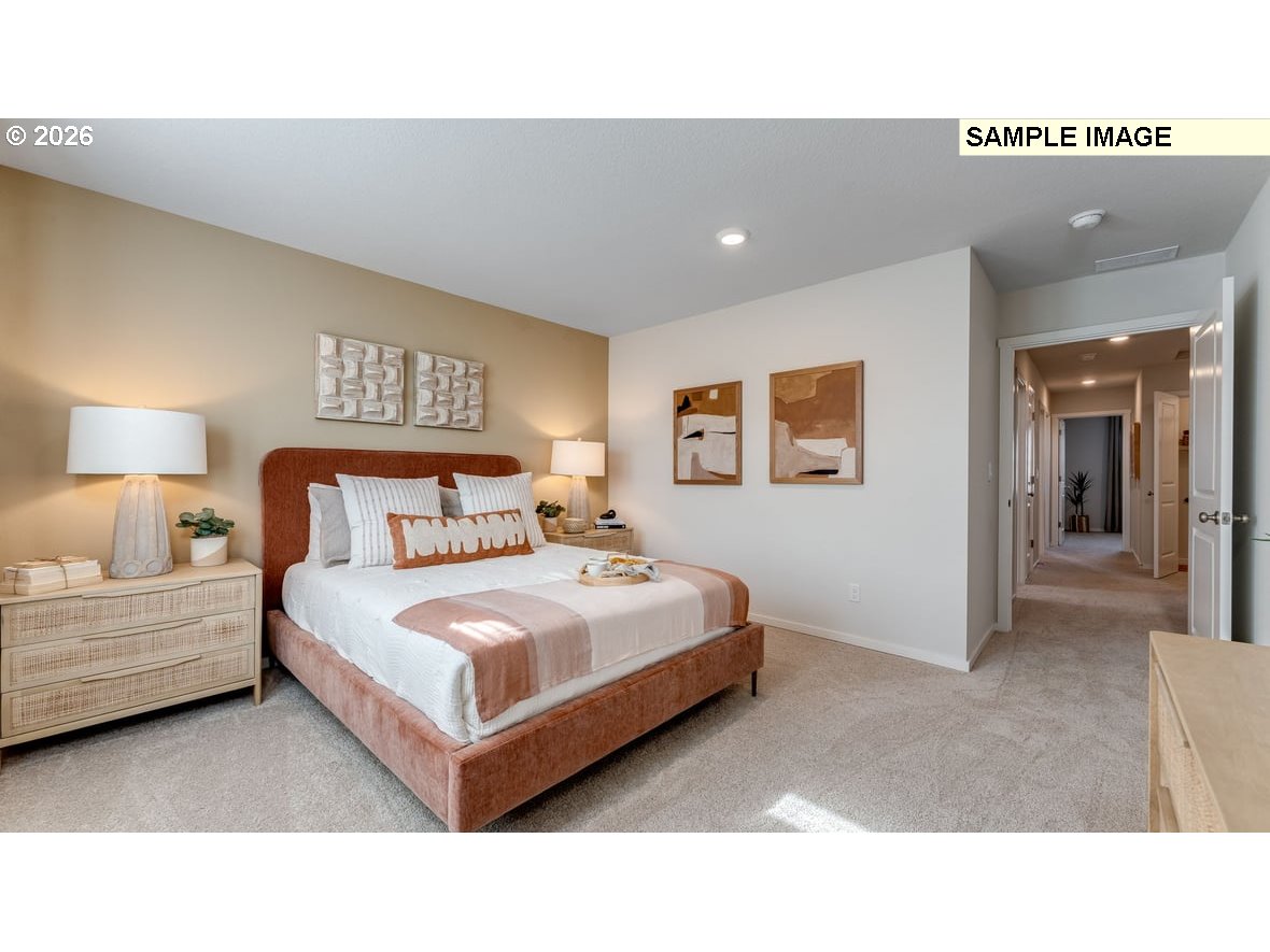 126 Coho Loop Woodland, WA 98674 - Photo 19 of 27 a bedroom with a bed and a night stand