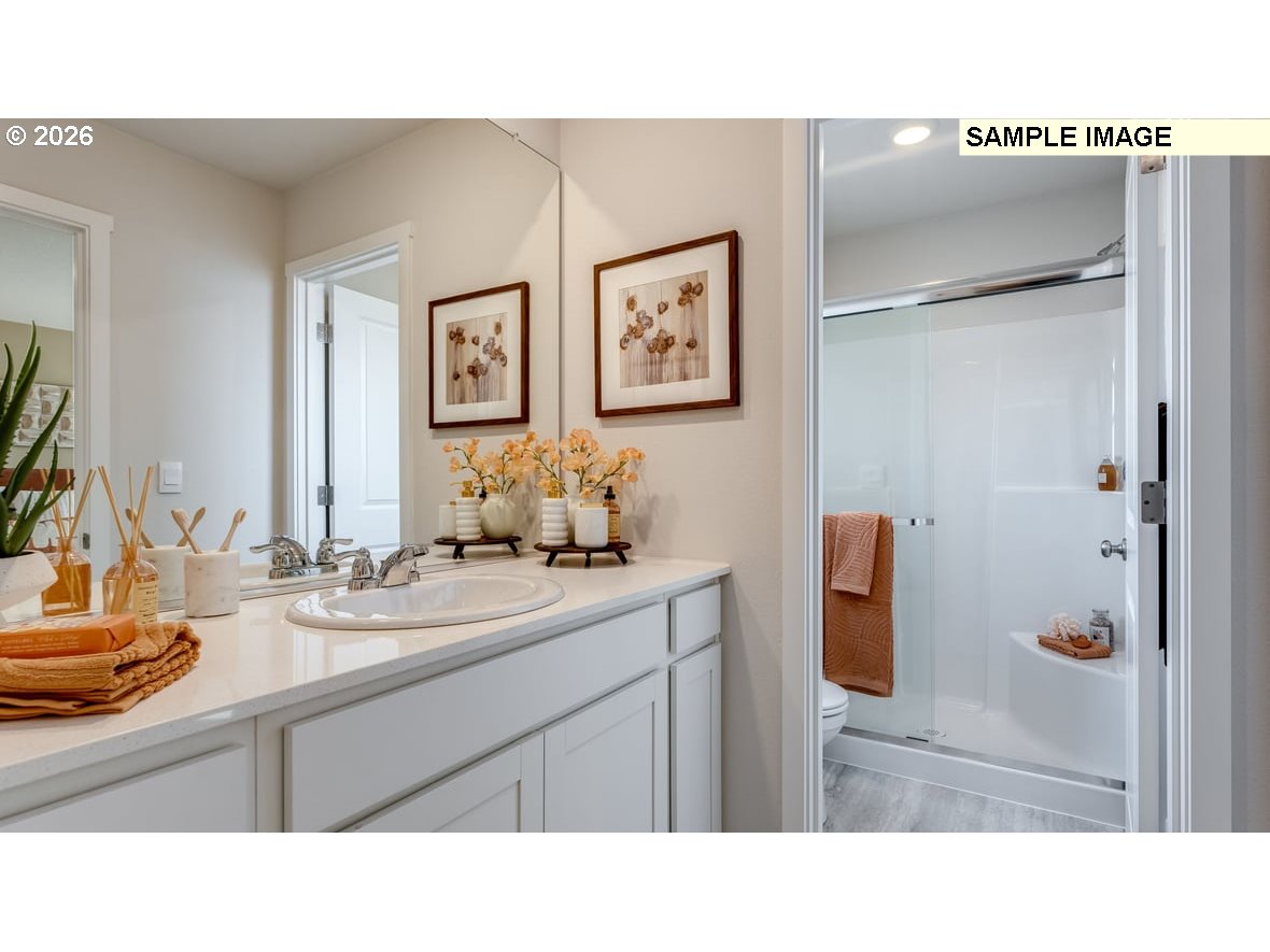 126 Coho Loop Woodland, WA 98674 - Photo 20 of 27 a kitchen with a sink and a refrigerator