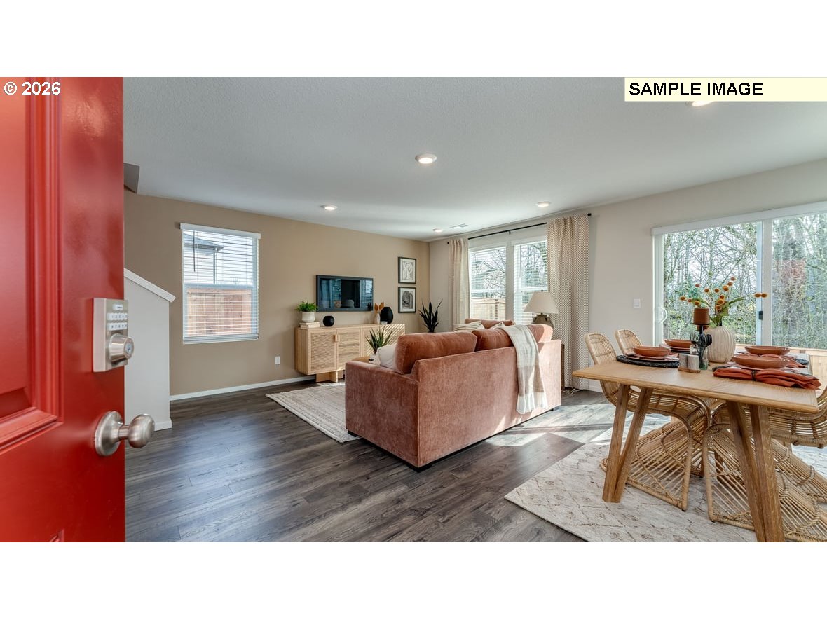 126 Coho Loop Woodland, WA 98674 - Photo 2 of 27 a living room with furniture and a wooden floor