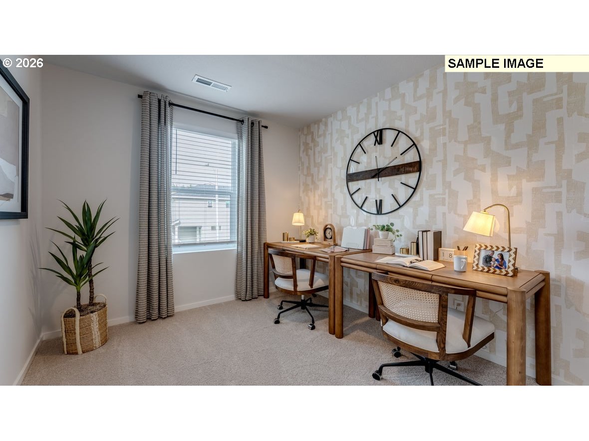 126 Coho Loop Woodland, WA 98674 - Photo 22 of 27 a living room with furniture a window and a clock