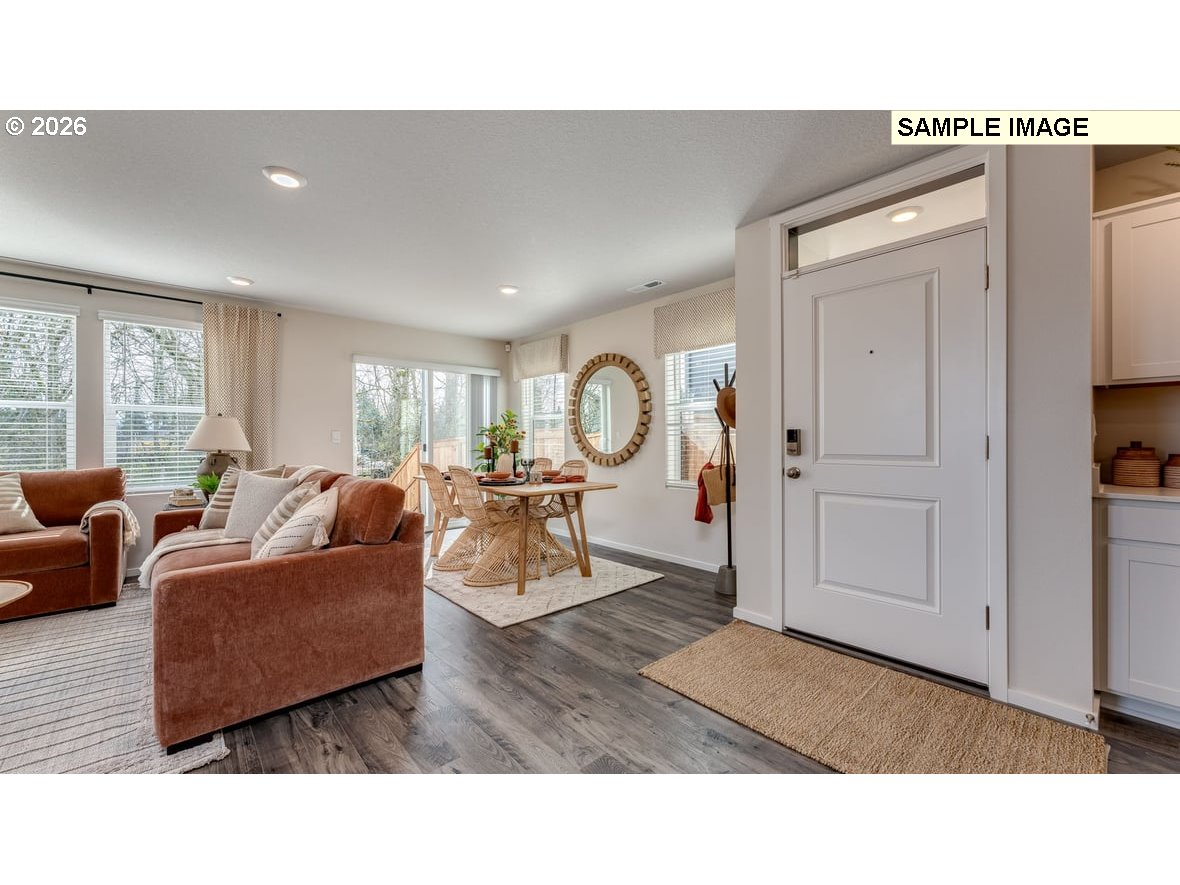126 Coho Loop Woodland, WA 98674 - Photo 3 of 27 a living room with furniture a rug and white walls