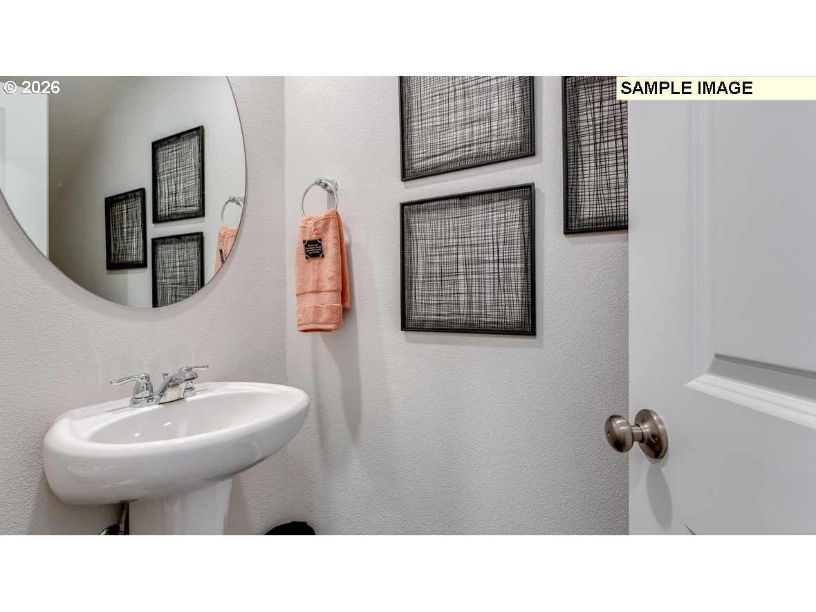 126 Coho Loop Woodland, WA 98674 - Photo 7 of 27 a bathroom with a sink and a mirror