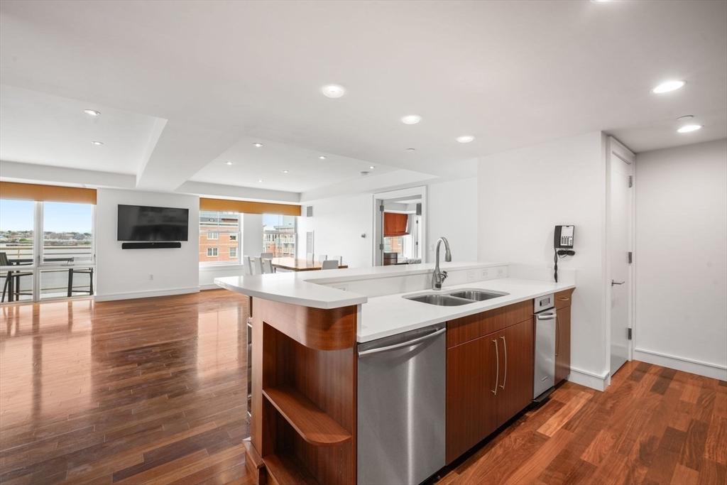 2 Battery Wharf, Unit 2504 Boston, MA 02109 - Photo 11 of 22 a kitchen with a sink and wooden floor