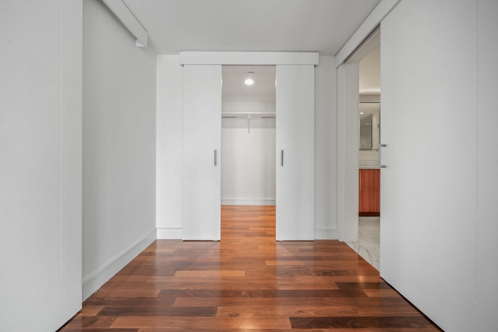 2 Battery Wharf, Unit 2504 Boston, MA 02109 - Photo 13 of 22 a view of a hallway with wooden floor