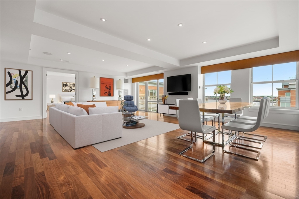 2 Battery Wharf, Unit 2504 Boston, MA 02109 - Photo 2 of 22 a living room with fireplace furniture and a wooden floor