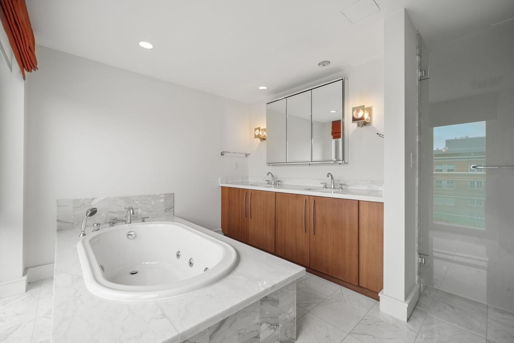 2 Battery Wharf, Unit 2504 Boston, MA 02109 - Photo 4 of 22 a bathroom with a sink a window and a mirror