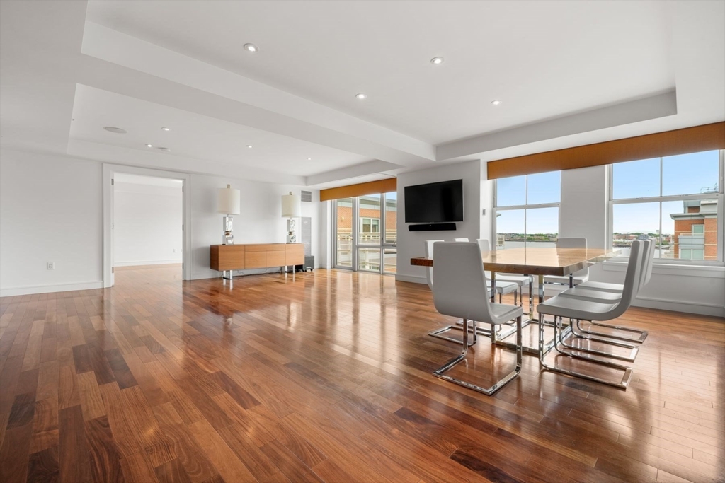 2 Battery Wharf, Unit 2504 Boston, MA 02109 - Photo 7 of 22 a living room with furniture and a wooden floor