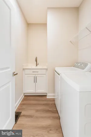 a room with a sink and cabinets