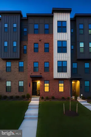 a front view of a building with a yard