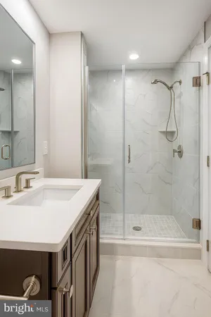 a bathroom with a sink a mirror and a bathtub