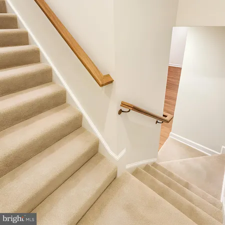 a view of staircase with white walls