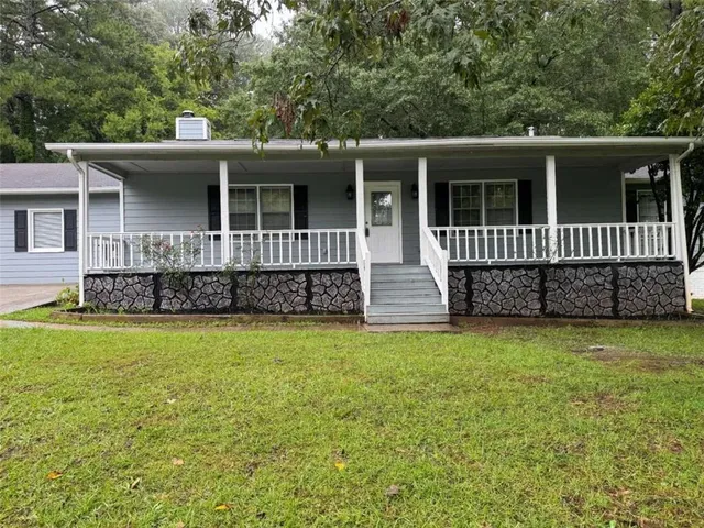 front view of a house with a yard