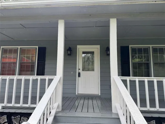 a view of wooden deck and a window