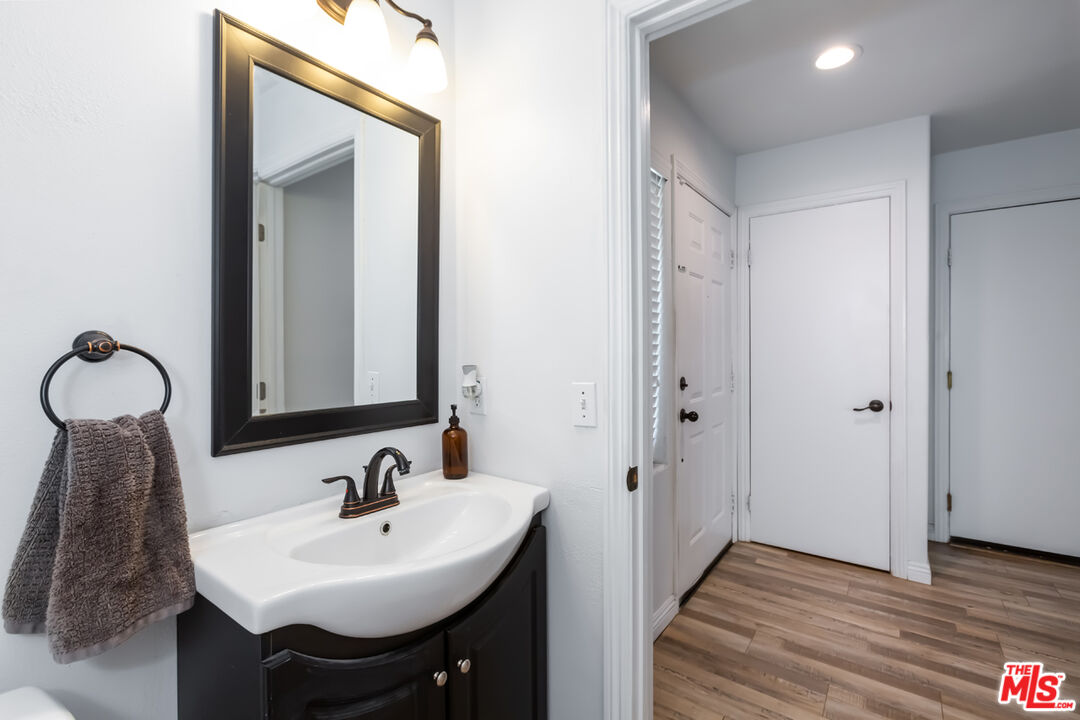 12248 Willowbend Lane Sylmar, CA 91342 - Photo 23 of 52 a bathroom with a sink and a mirror