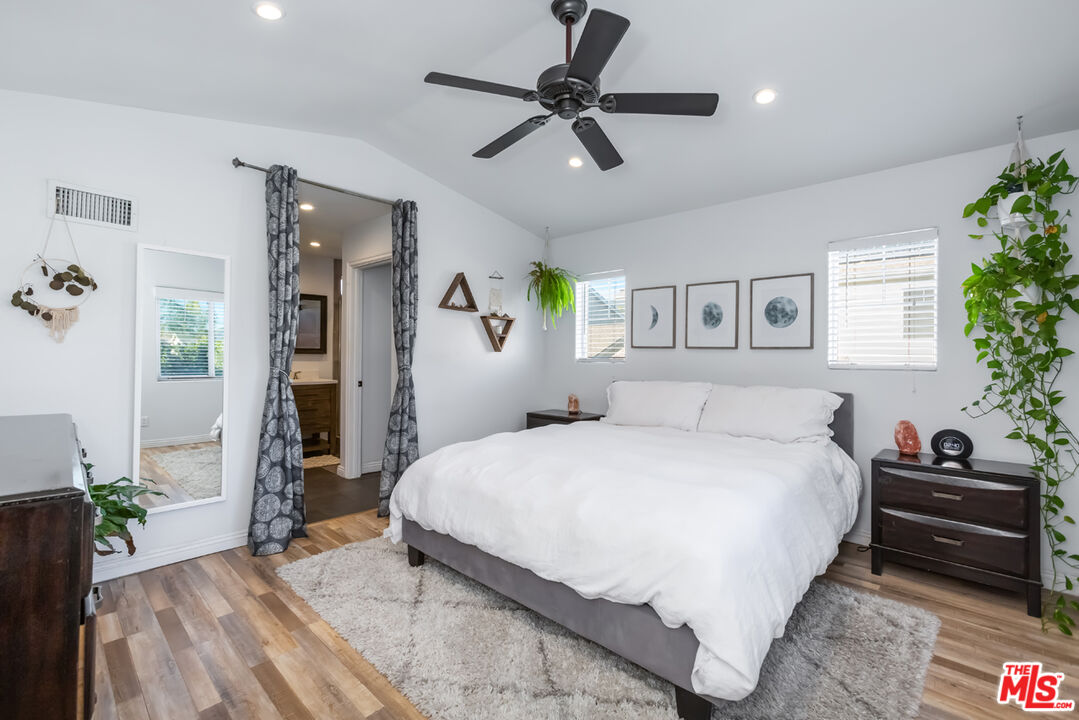 12248 Willowbend Lane Sylmar, CA 91342 - Photo 24 of 52 a bedroom with a bed dresser and a window