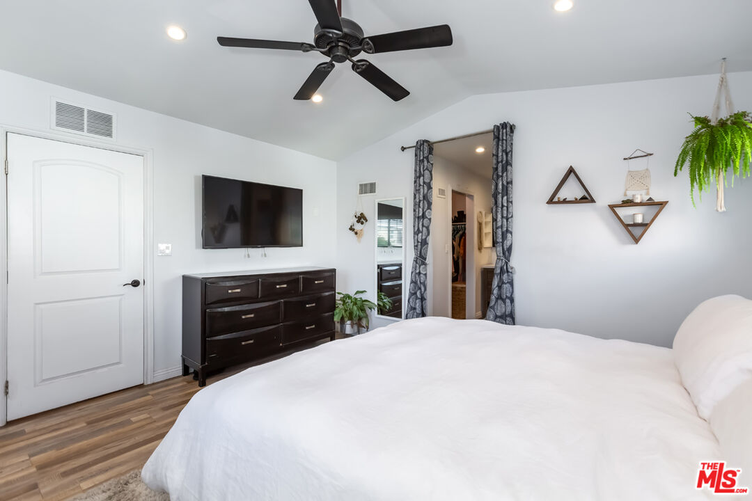 12248 Willowbend Lane Sylmar, CA 91342 - Photo 25 of 52 a bedroom with a bed and a flat screen tv