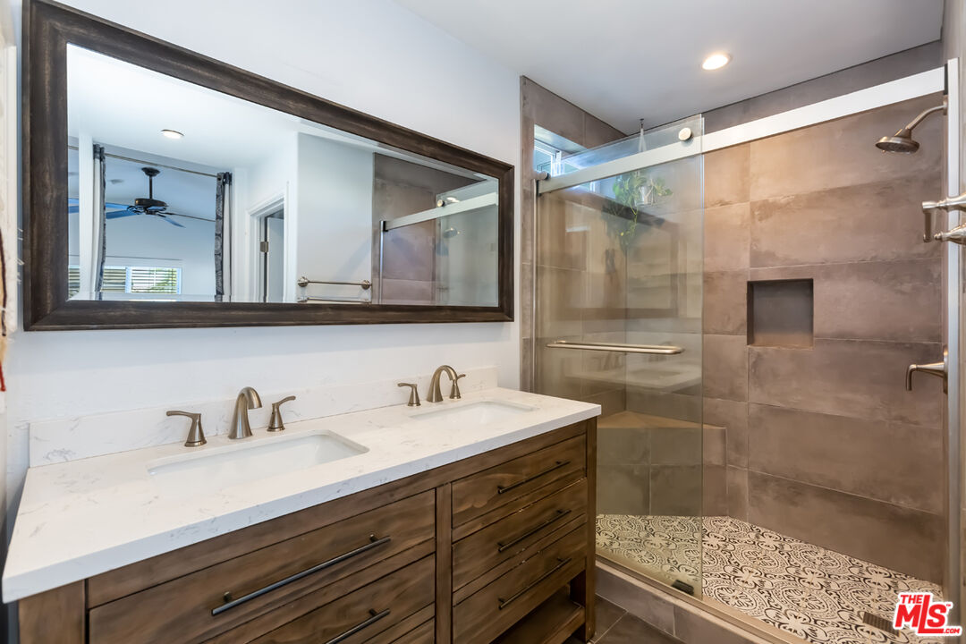 12248 Willowbend Lane Sylmar, CA 91342 - Photo 27 of 52 a bathroom with a sink and a mirror