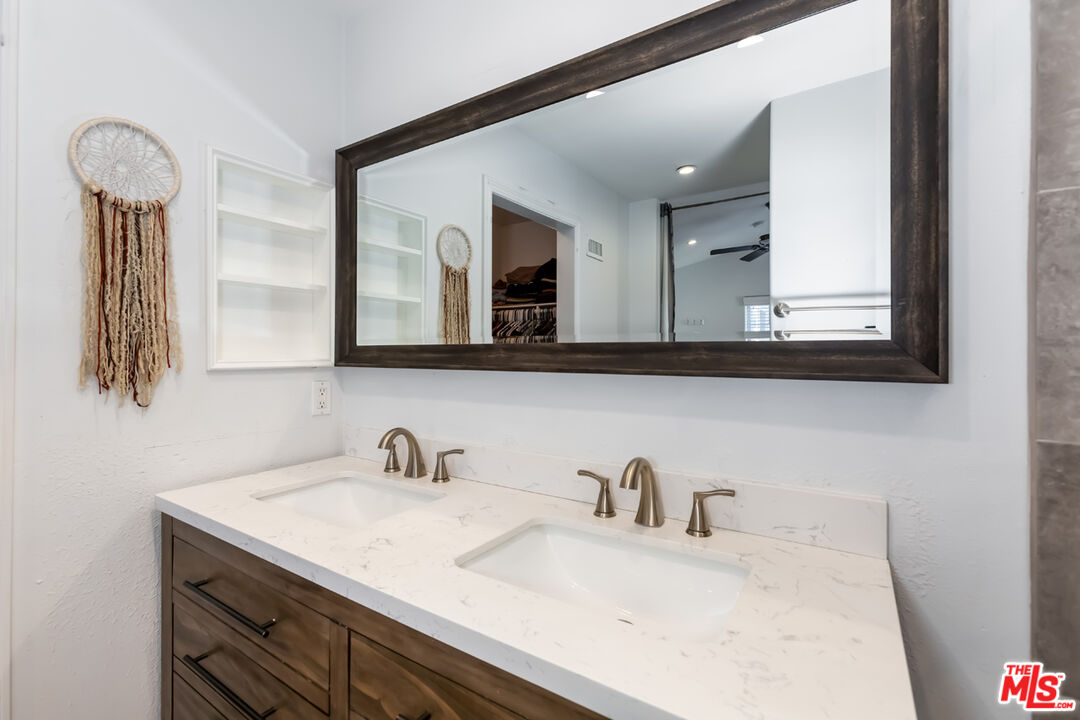 12248 Willowbend Lane Sylmar, CA 91342 - Photo 28 of 52 a bathroom with a sink and a mirror
