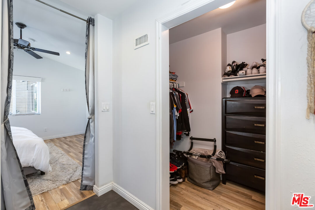 12248 Willowbend Lane Sylmar, CA 91342 - Photo 30 of 52 a view of walk in closet with clothes and shoes