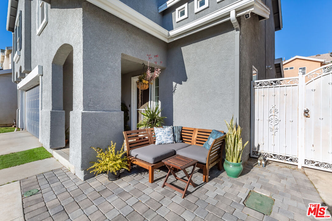 12248 Willowbend Lane Sylmar, CA 91342 - Photo 3 of 52 a backyard of a house with table and chairs
