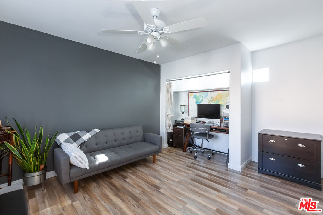 12248 Willowbend Lane Sylmar, CA 91342 - Photo 31 of 52 a living room with furniture and a flat screen tv