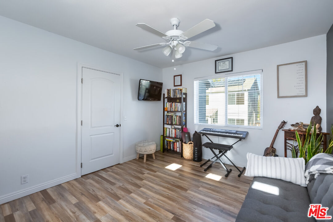 12248 Willowbend Lane Sylmar, CA 91342 - Photo 33 of 52 a living room with furniture and a flat screen tv