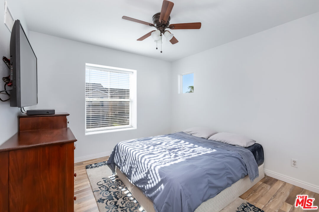 12248 Willowbend Lane Sylmar, CA 91342 - Photo 34 of 52 a bedroom with a bed and a window