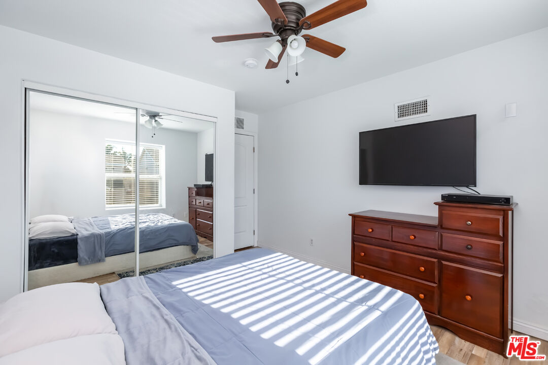 12248 Willowbend Lane Sylmar, CA 91342 - Photo 36 of 52 a bedroom with a bed and a flat screen tv