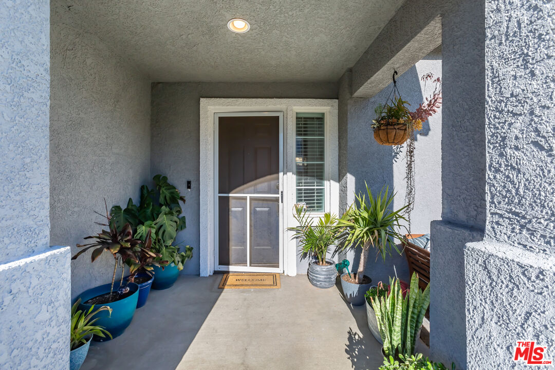 12248 Willowbend Lane Sylmar, CA 91342 - Photo 4 of 52 a potted plant in front of a house