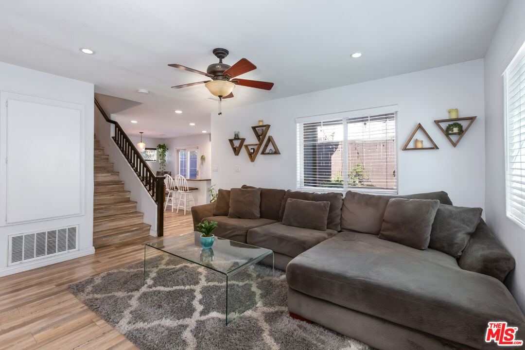 12248 Willowbend Lane Sylmar, CA 91342 - Photo 7 of 52 a living room with furniture and a wooden floor