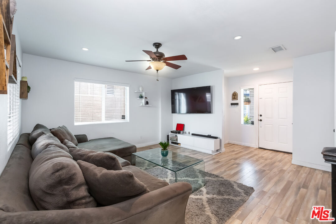 12248 Willowbend Lane Sylmar, CA 91342 - Photo 8 of 52 a living room with furniture and a flat screen tv